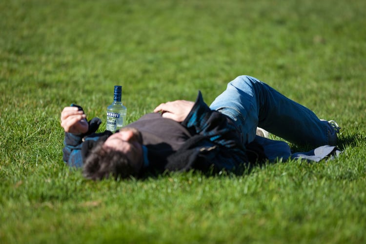 man laying on grass